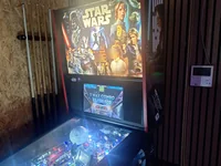 Star Wars pinball machine in a room with wood-paneled walls. - Photo by glenn pellis (20 Jul 2026)