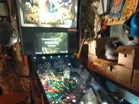 A Star Wars pinball machine is set up for play in a dimly lit room. - Photo by cLx (4 Aug 2026)
