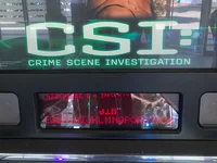 A close-up of a CSI pinball machine's translite and digital score display. - Photo by PinballJim (23 Jul 2026)
